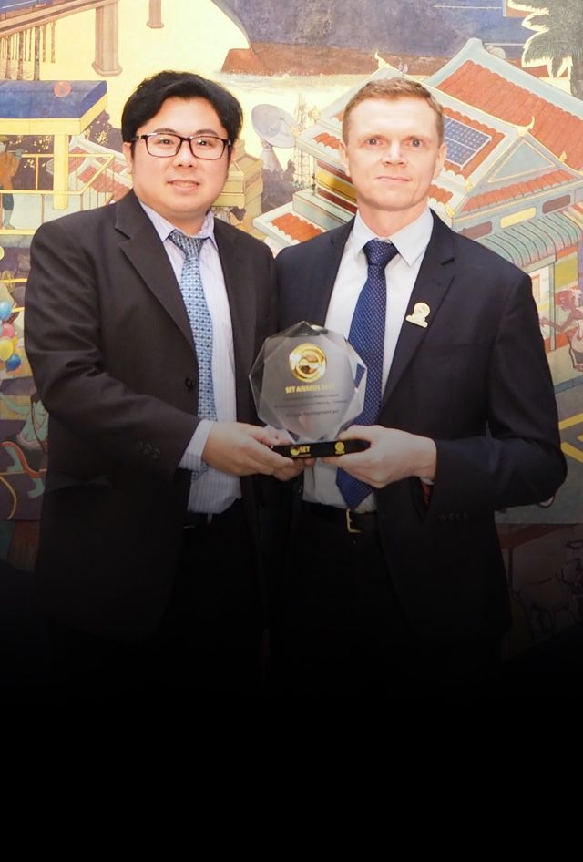 Dr. John Leslie Millar and Mr. Komsan Atthaphonphithak
